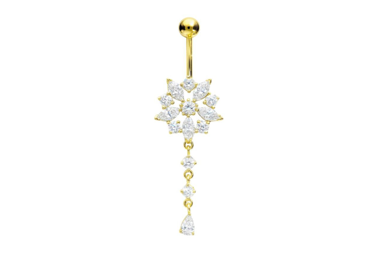 gold dangle belly ring with a snowflake design