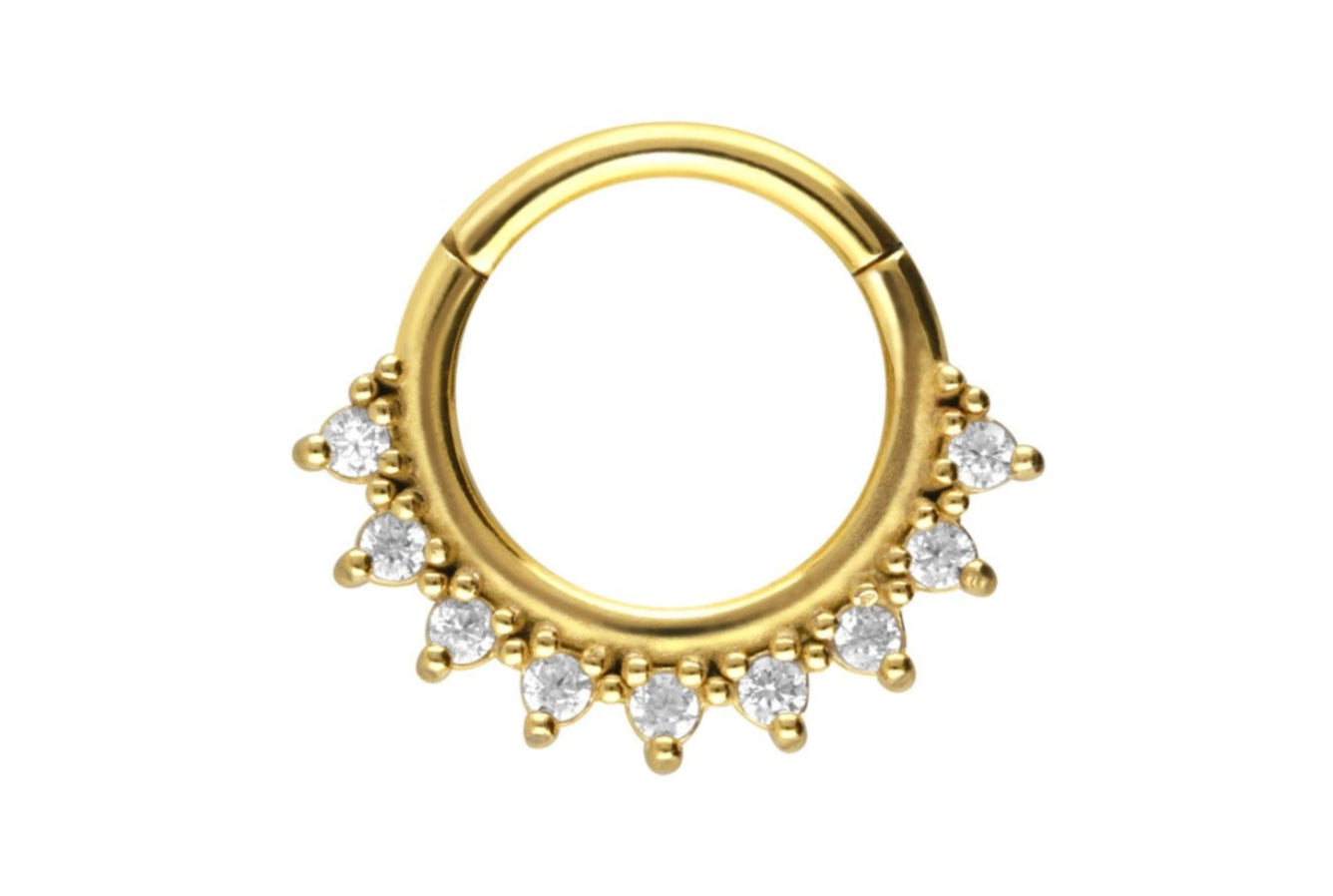 gold daith earring with dainty crystals along the outer side of the hoop