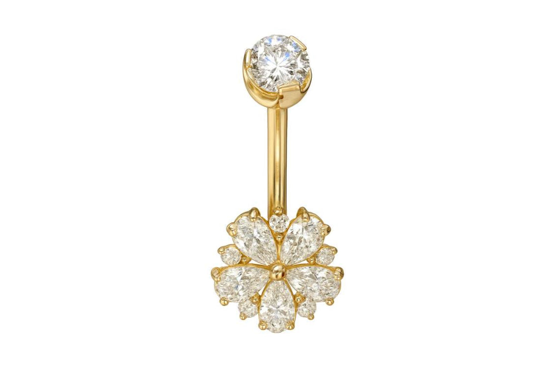 gold belly ring with a dainty flower design