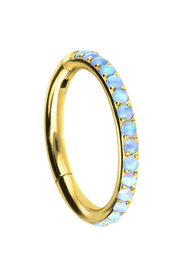 gold conch piercing jewelry featuring dainty blue opals